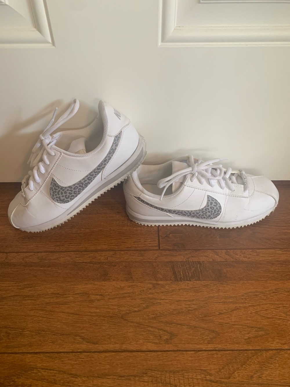 Nike White Cortez Sneakers with Grey Leopard Swoosh